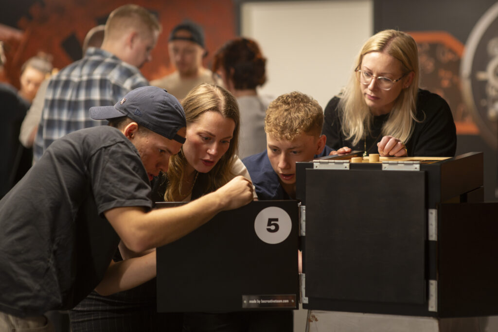 A group collaborates around an interactive activity.